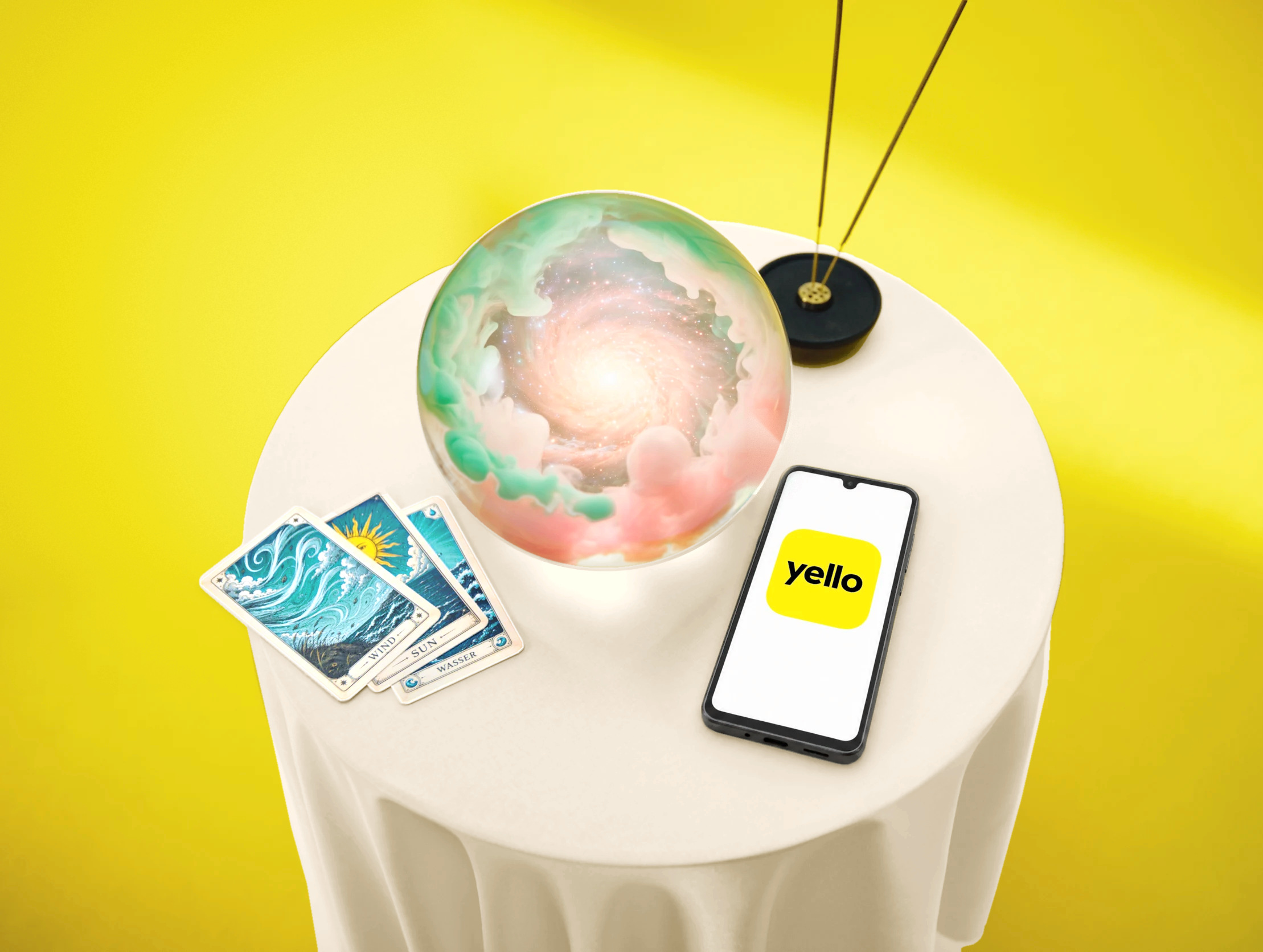 Eine Glaskugel liegt auf dem Tisch und ein Handy mit Yello Logo daneben - KI generiert