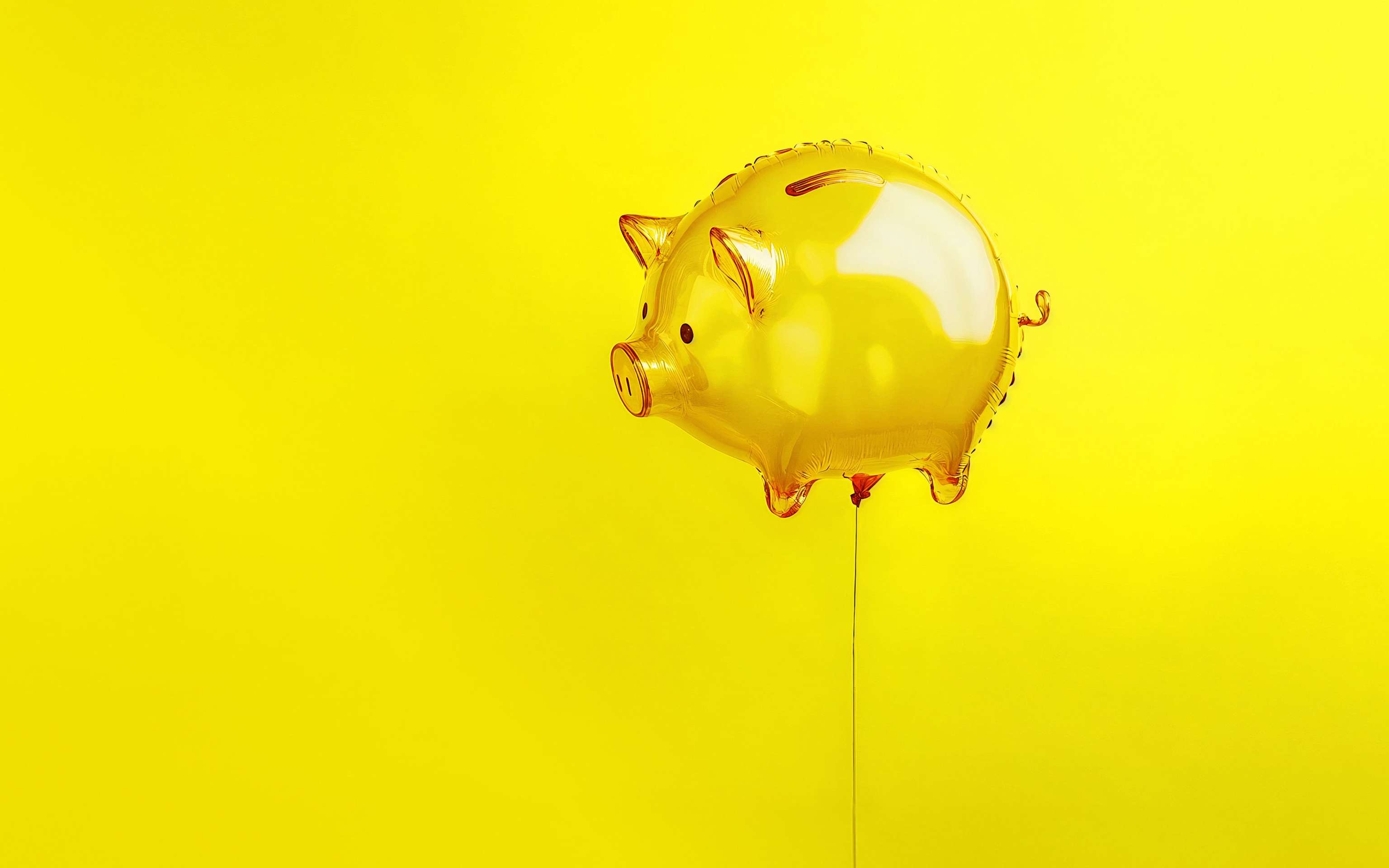 Günstiger Strom und gute Energie von Yello Ein gelbes Sparschein als Luftballon an einer Schnur - KI Generiert